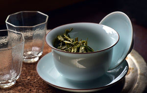 Tea cup with loose leaf green tea