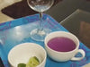 Butterfly pea flower tea pouring with lime 